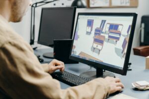 a man using a computer in designing